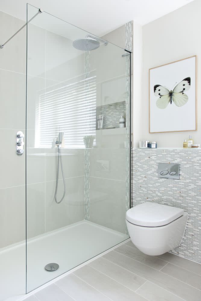 <p>The walk-in shower with a low-profile tray taps into a minimalist look, creating a light and airy feel. </p><p><a class="link " href="https://www.housebeautiful.com/uk/renovate/homes-makeovers/a977/bathroom-makeover-textured-tiles/" rel="nofollow noopener" target="_blank" data-ylk="slk:TAKE A TOUR;elm:context_link;itc:0;sec:content-canvas">TAKE A TOUR</a></p>