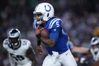 Indianapolis Colts quarterback Anthony Richardson (5) runs for a first down during the first half of an NFL preseason football game against the Philadelphia Eagles on Thursday, Aug. 24, 2023, in Philadelphia. (AP Photo/Matt Slocum)