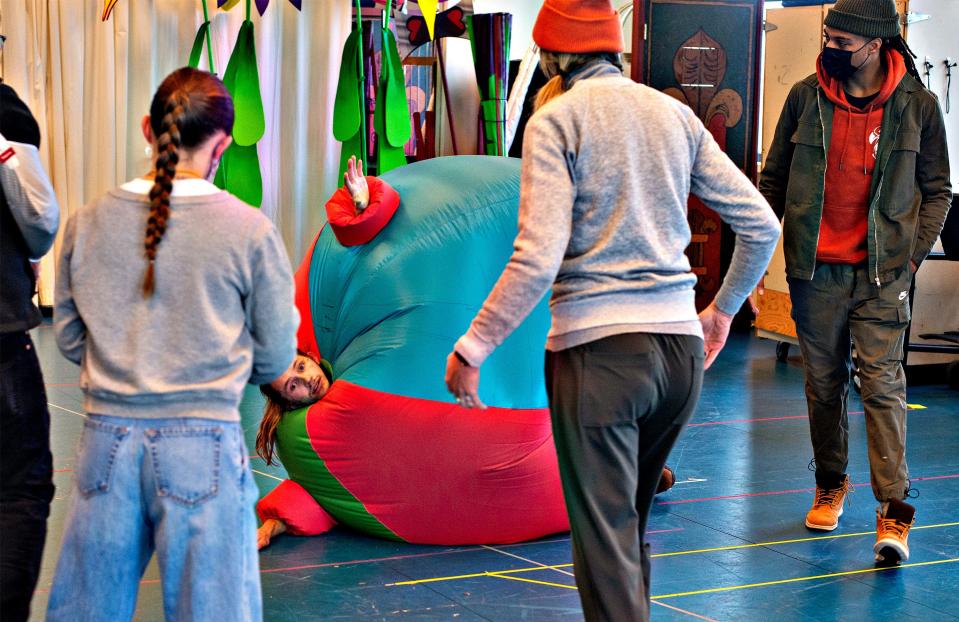 Keegan Robinson is on his side in an inflatable suit rehearsing as Tweedle Dee for CTC's "Alice in Wonderland."