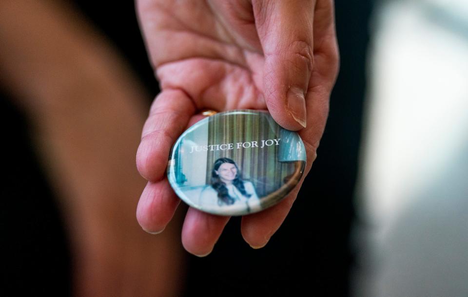 Lori Kennedy, Joy Hibb's sister-in-law, holds a button she made reading 'Justice For Joy' just before the trial of Robert Atkins at the Bucks County Justice Center in Doylestown on Monday, Jan. 29, 2024.

Daniella Heminghaus | Bucks County Courier Times