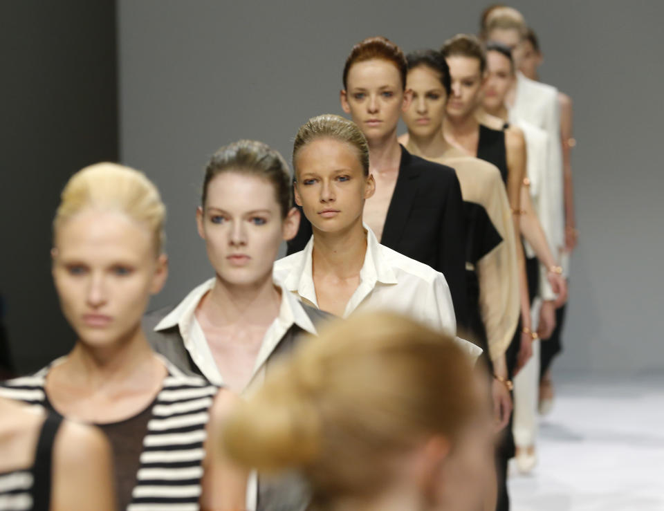 Models walk at the end of Veronique Branquinho's Spring Summer 2013 ready to wear collection, presented in Paris, Tuesday, Sept.25, 2012. (AP Photo/Jacques Brinon)