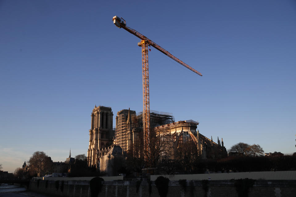 Notre Dame cathedral is pictured in Paris, Monday, Jan. 6, 2020. Gen. Jean-Louis Georgelin who is overseeing the reconstruction of the fire-devastated Notre Dame Cathedral told French broadcaster CNews on Sunday that "the cathedral is still in a state of peril" after last year's fire, which destroyed its roof and collapsed its spire as the cathedral was undergoing renovations. (AP Photo/Francois Mori)