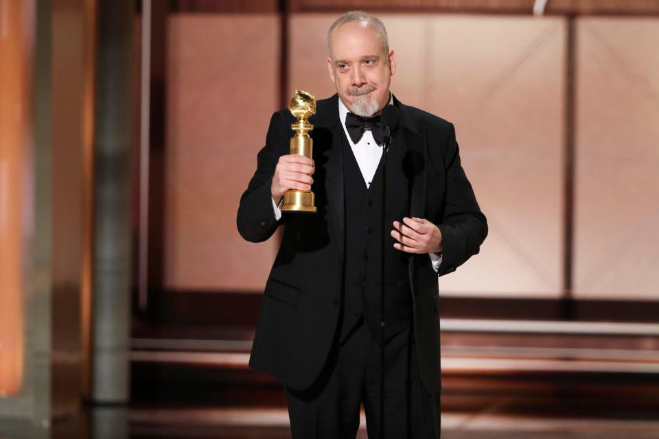 Paul Giamatti accepts the award for best actor in a motion picture - musical or comedy for his role in "The Holdovers." (Credit: Sonja Flemming, CBS via AP)