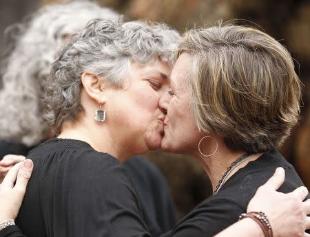 Donna and Tina kiss after getting married in a park outside the Jefferson County Courthouse in Birmingham, Alabama February 9, 2015. REUTERS/Marvin Gentry