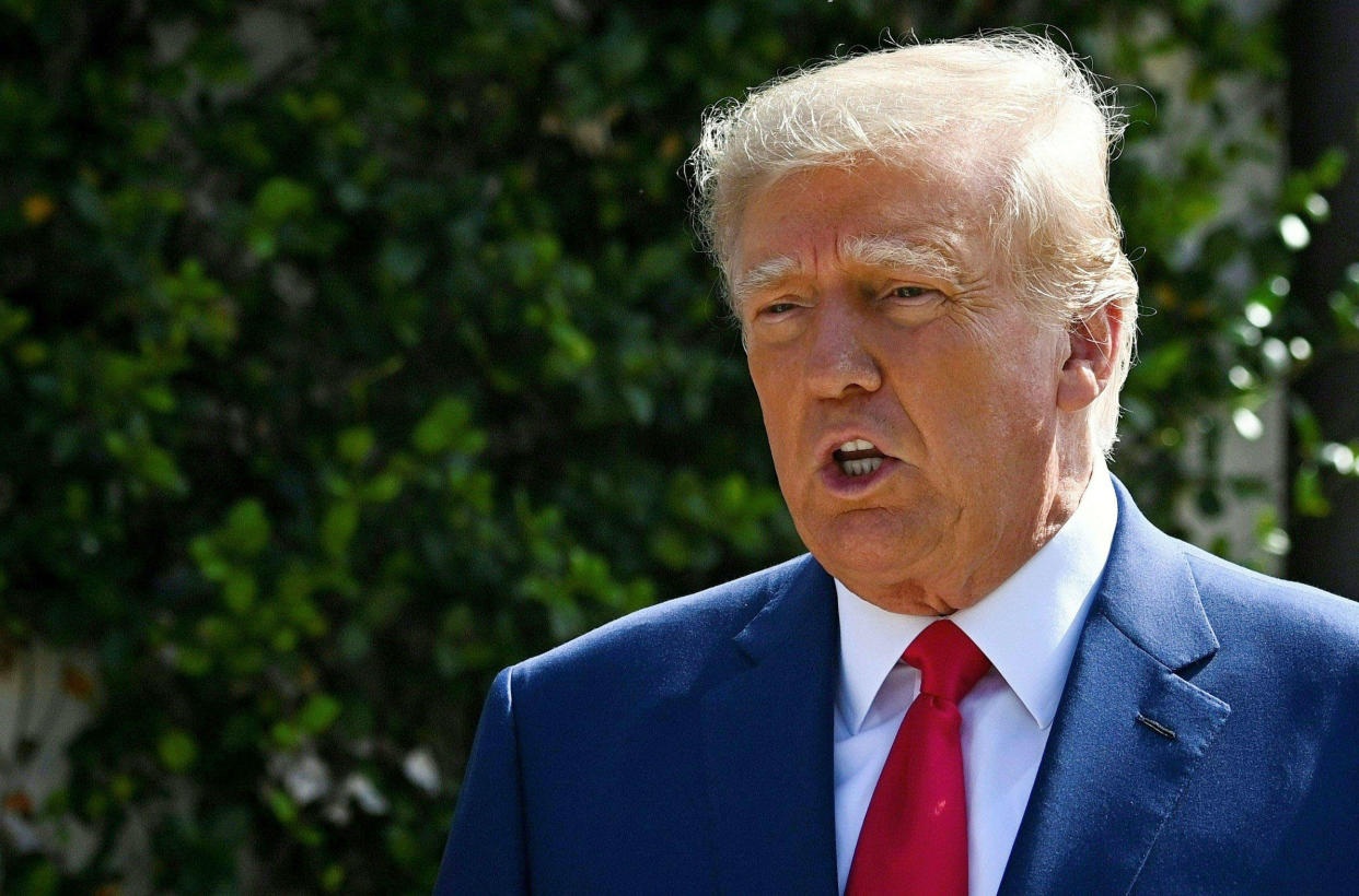 (FILES) In this file photo taken on November 08, 2022 former US President Donald Trump speaks to the media while departing a polling station after voting in the US midterm elections at Morton and Barbara Mandel in Palm Beach, Florida. - Former US president Donald Trump is urging Facebook to reinstate his account two years after it was deactivated, his aides said January 18, 2023, as he gears up for a third bid for the White House. (Photo by Eva Marie UZCATEGUI / AFP)