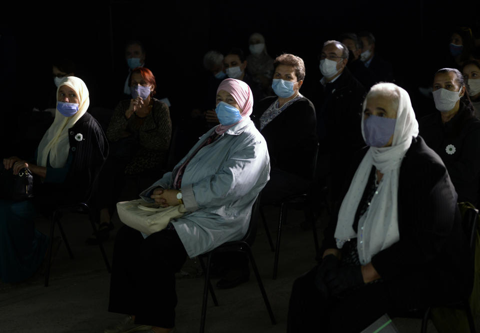 Massacre survivors and young people from across ethnically and politically divided country attend the first public showing of Bosnian filmmaker Jasmila Zbanic's film on the 1995 massacre in Srebrenica - "Quo Vadis, Aida?", in the eastern Bosnian town of Srebrenica, Saturday, Oct. 10, 2020. The Srebrenica massacre was the culmination of Bosnia's 1992-95 war, which pitted the country's three main ethnic factions - Serbs, Croats and Bosnian Muslims. (AP Photo/Kemal Softic)