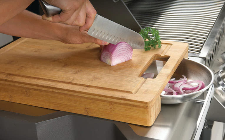 wooden cutting board with included scraps holder