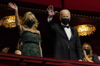 President Joe Biden and first lady Jill Biden wave as they arrive at the 44th Kennedy Center Honors at the John F. Kennedy Center for the Performing Arts in Washington, Sunday, Dec. 5, 2021. The 2021 Kennedy Center honorees include Motown Records creator Berry Gordy, "Saturday Night Live" mastermind Lorne Michaels, actress-singer Bette Midler, opera singer Justino Diaz and folk music legend Joni Mitchell. (AP Photo/Carolyn Kaster)