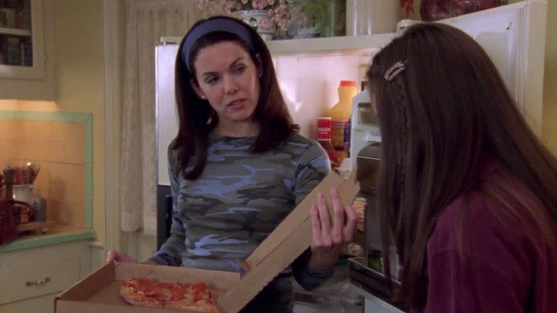 <p> Not even pizza (the ultimate accessory) can lend credence to this headband + camo combination. </p>