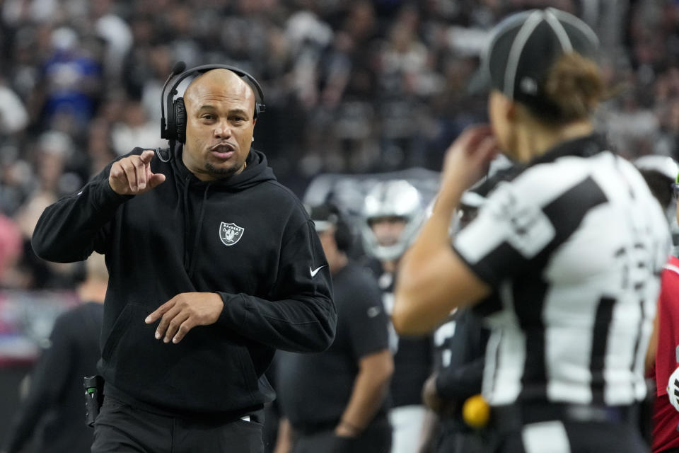 Las Vegas Raiders interim head coach Antonio Pierce talks with a referee during the first half of an NFL football game against the New York Giants, Sunday, Nov. 5, 2023, in Las Vegas. (AP Photo/Rick Scuteri)