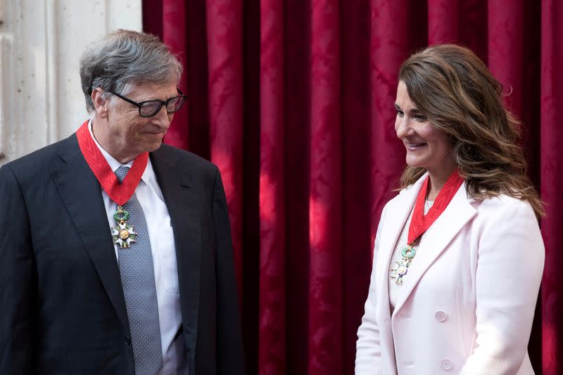 FILE PHOTO: Philanthropist and co-founder of Microsoft, Bill Gates and his wife Melinda talk, after being awarded Commanders of the Legion of Honor at the Elysee Palace in Paris