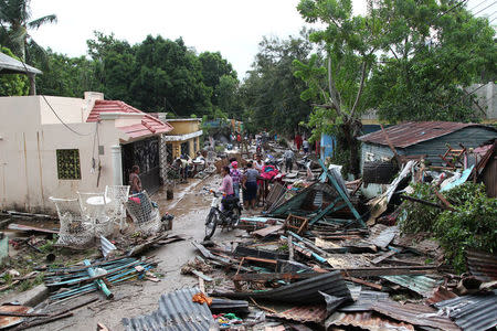 Locals stand along a street affected by the overflow of the Soco River in the aftermath of Hurricane Maria in El Seibo, Dominican Republic, September 22, 2017. REUTERS/Ricardo Rojas