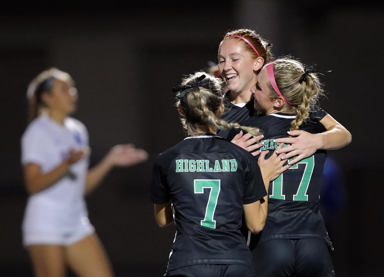 Highland's Jillian Miller, facing, celebrates after scoring against Revere with teammates Mira Simic, left, and Vanessa Zufall, right, on Sept. 27.