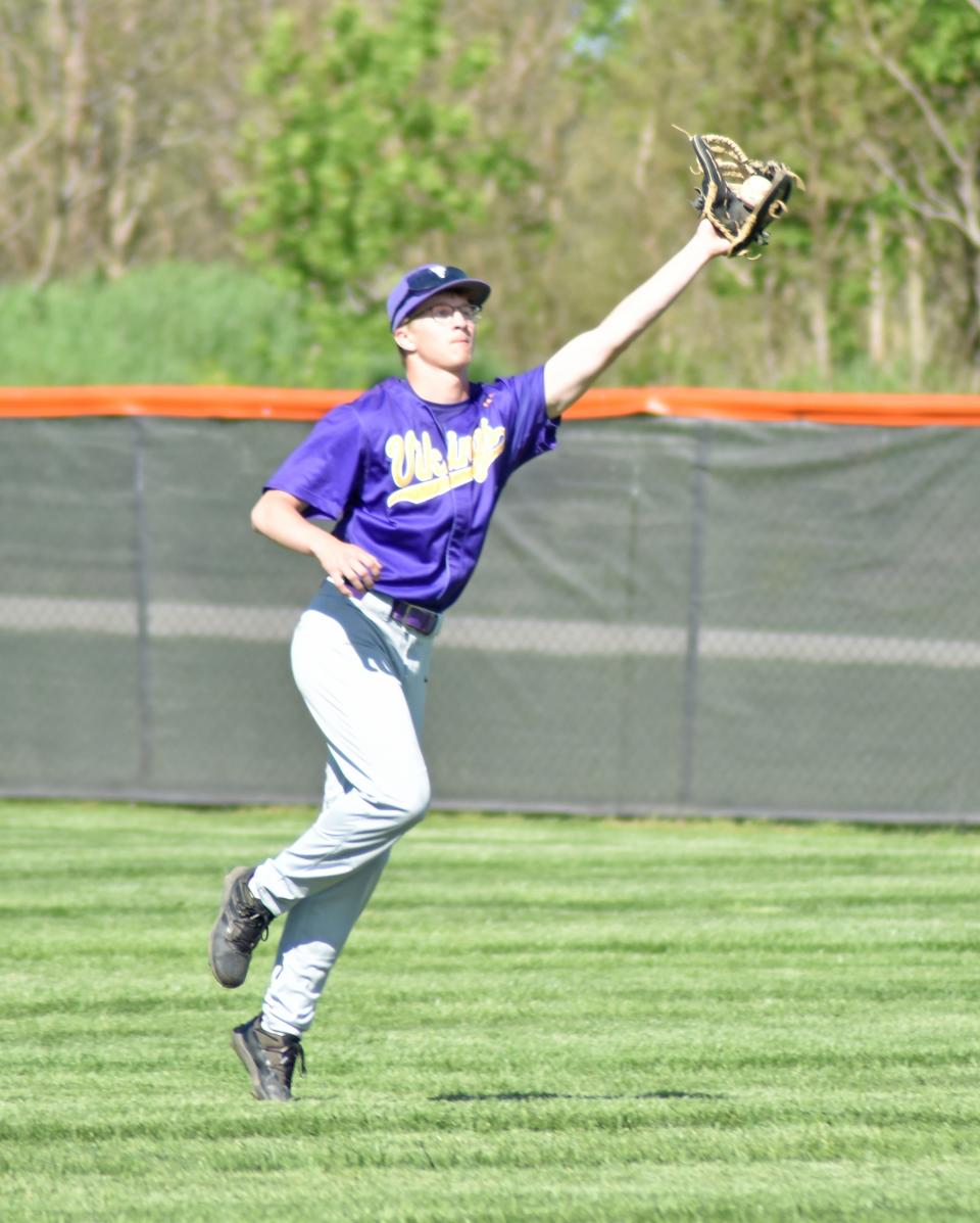 Bronson right fielder Logan Long tracks down a hot shot to the outfield Wednesday versus Quincy