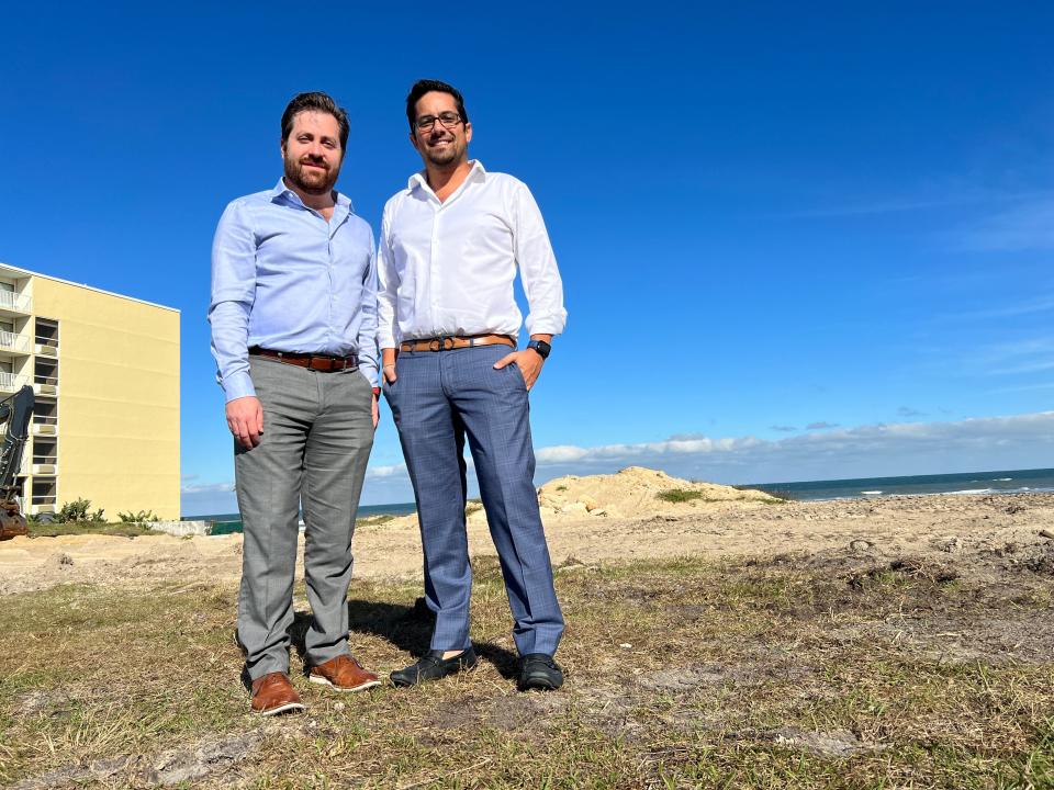Mauricio Lan, left, and Allan Agami of Clearwater-based Valor Capital stand on an oceanfront lot at 3411 S. Atlantic Ave. in Daytona Beach Shores where their company plans to develop an 18-story, 86-unit luxury condominium complex on Dec. 11, 2023. Lan is an architect and executive development coordinator for Valor. Agami is the project manager.