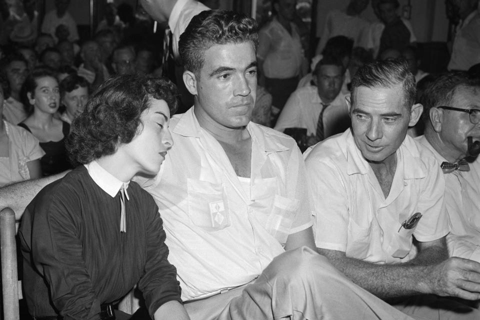 FiLE - In this Sept. 22. 1955 photo, Carolyn Bryant, left, rests her head on her husband Roy Bryant's shoulder after she testified in court about the murder of Emmett Till in Sumner, Miss. Carolyn Bryant Donham, the white woman who accused Black teenager Emmett Till of making improper advances before he was lynched in Mississippi in 1955 has died Tuesday night, April 25, in hospice care in Louisiana, according to a death report filed Thursday, April 27, 2023, in Calcasieu Parish Coroner’s Office in Louisiana. She was 88. (AP Photo/File)