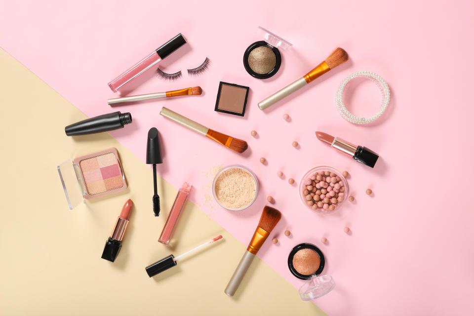 Set of decorative cosmetics on a colored background