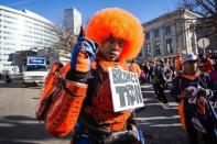 Feb 9, 2016; Denver, CO, USA; Denver Broncos fan Michael Potts dressed as Bronco Tron joins the crowd at Civic Center Park for the Super Bowl 50 championship parade. Mandatory Credit: Isaiah J. Downing-USA TODAY Sports