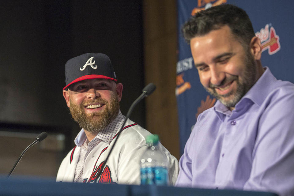 Brian McCann, left, and Atlanta Braves General manager Alex Anthopoulo speak during a news conference at the Delta360 Club at SunTrust Park in Atlanta Monday, Nov. 26, 2018. McCann recently signed to a one-year contract with the Atlanta Braves for $2 million. (Alyssa Pointer/Atlanta Journal-Constitution via AP)