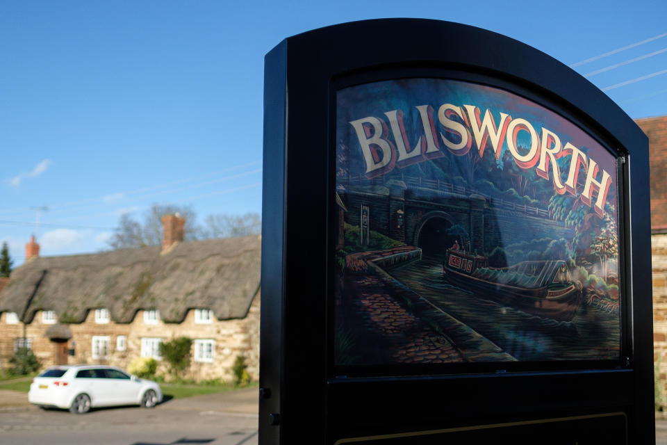 BLISWORTH, UNITED KINGDOM - FEBRUARY 15:  A sign promoting Blisworth village is seen on February 15, 2018 in the village of Blisworth, United Kingdom.  Northamptonshire County Council has banned all new spending after announcing an overspend of £21m for the 2017-18 period. As it attempts to pay off £150m of loans, the council is looking at selling it's new £53m headquarters at One Angel Square, which was only opened in October 2017.  Cuts to libraries, bus services and winter road gritting have also been proposed.  (Photo by Leon Neal/Getty Images)