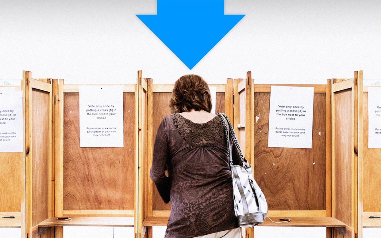 Woman in a voting booth