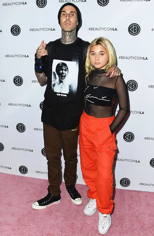 <p>Jon Kopaloff/FilmMagic</p> Travis Barker and Alabama Barker attend Beautycon Festival at Los Angeles Convention Center on July 14, 2018 in Los Angeles, California.