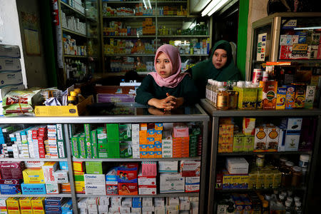 Vendors stand as they wait for customers inside a stall at a wholesale market for medicines in Jakarta, Indonesia, February 15, 2019. REUTERS/Willy Kurniawan