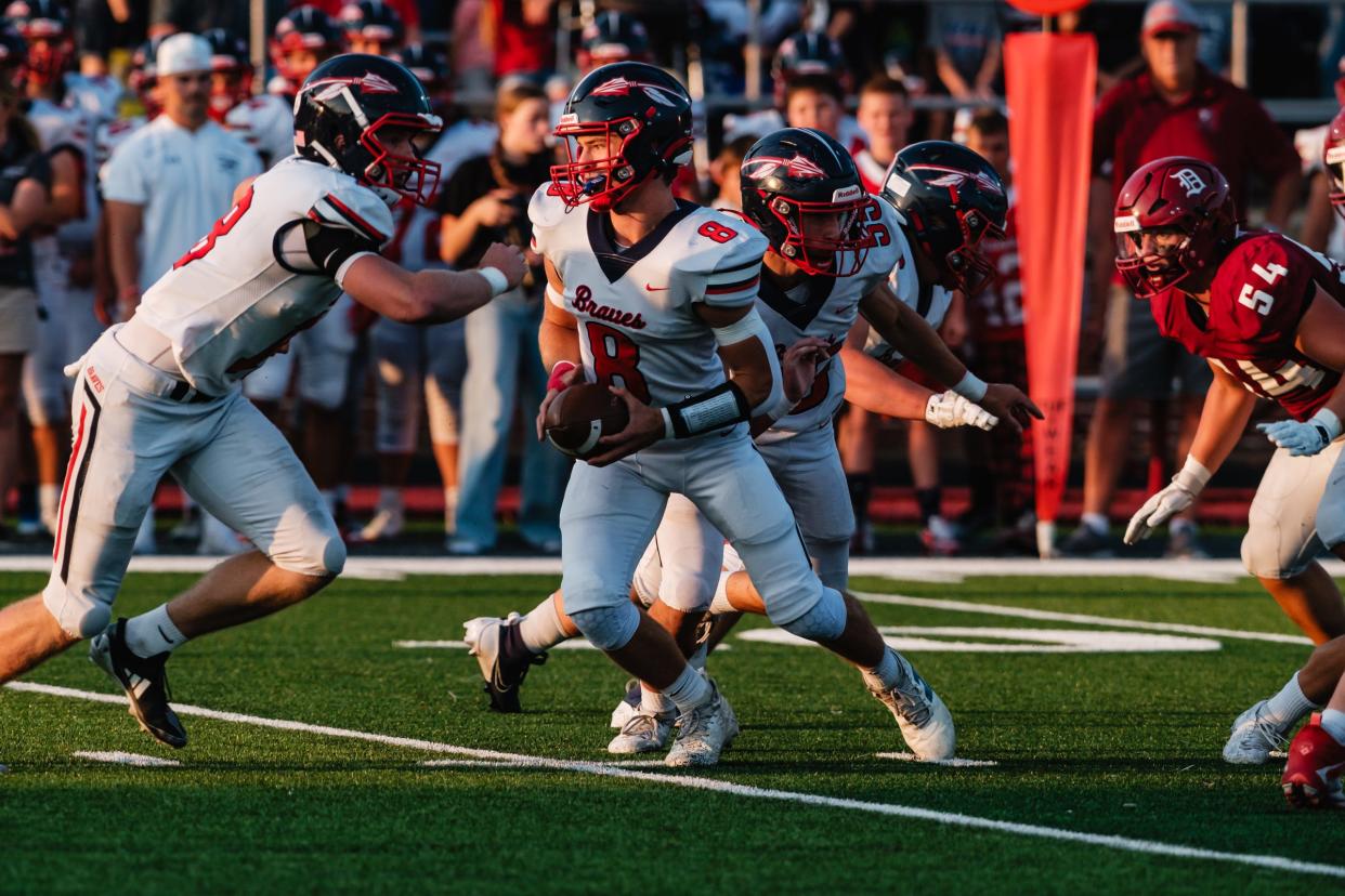 Indian Valley quarterback Ryker Williams looks to make a handoff in a game against Dover, Friday, Sept. 15 at Crater Stadium, in Dover.