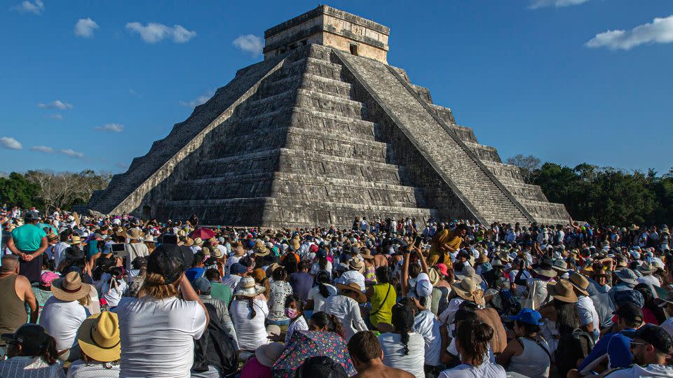 People surround the Kukulcan Pyramid at the Mayan archaeological site of Chichén Itzá in Yucatan State, Mexico, during the celebration of the spring equinox in 2023. - Hugo Borges/AFP/Getty Images