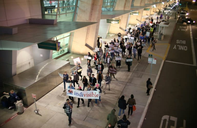 Protesters chant during a rally against US President Donald Trump's revised travel ban on refugees and on travelers from six Muslim-majority nations, at San Diego International Airport in California, in March 2017