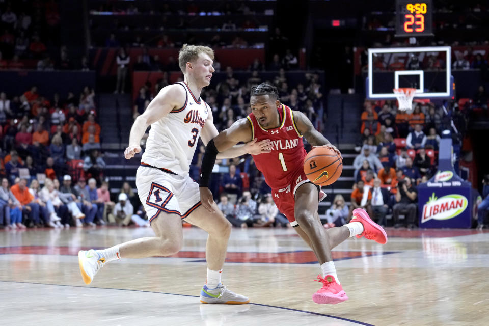 Maryland's Jahmir Young (1) drives to the basket as Illinois' Marcus Domask defends during the second half of an NCAA college basketball game Sunday, Jan. 14, 2024, in Champaign, Ill. Maryland won 76-67. (AP Photo/Charles Rex Arbogast)