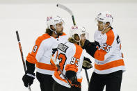 Philadelphia Flyers' Ivan Provorov (9), Jakub Voracek (93) and James van Riemsdyk (25) celebrate after van Riemsdyk scored a goal during the first period of an NHL hockey game against the New Jersey Devils Tuesday, Jan. 26, 2021, in Newark, N.J. (AP Photo/Frank Franklin II)