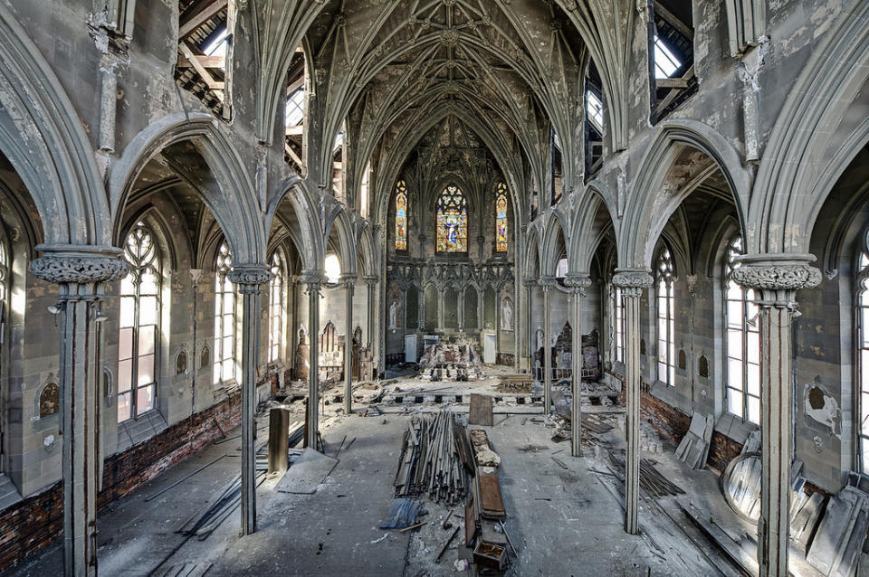 An abandoned church in Pennsylvania is filled with construction detritus below the graceful arches.  Credit: <a href="https://www.facebook.com/odinsravenphotography" target="_blank">Dan Marbaix</a>