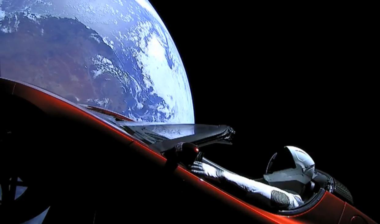  A camera shows SpaceX's Starman mannequin and Elon Musk's Tesla Roadster as they fly above a ROUND Earth after launching on the first Falcon Heavy rocket test flight on Feb. 6, 2018. 