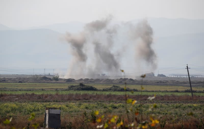 Smoke rises as targets are hit by shelling during the fighting over the breakaway region of Nagorno-Karabakh near the city of Terter