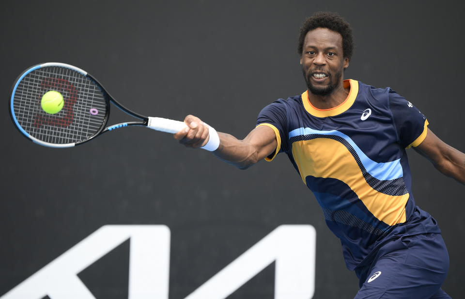 France's Gael Monfils makes a forehand return to Finland's Emil Ruusuvuori during their first round match at the Australian Open tennis championship in Melbourne, Australia, Monday, Feb. 8, 2021.(AP Photo/Andy Brownbill)