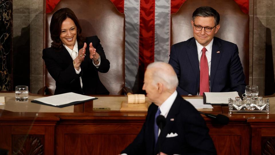 PHOTO: President Joe Biden looks back at Vice President Kamala Harris as he delivers his State of the Union address alongside Speaker of the House Mike Johnson at the U.S. Capitol on Mar. 7, 2024, in Washington. (Chip Somodevilla/Getty Images)