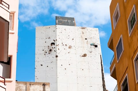 The scarred walls of the Holiday Inn - Credit: JOEL CARILLET