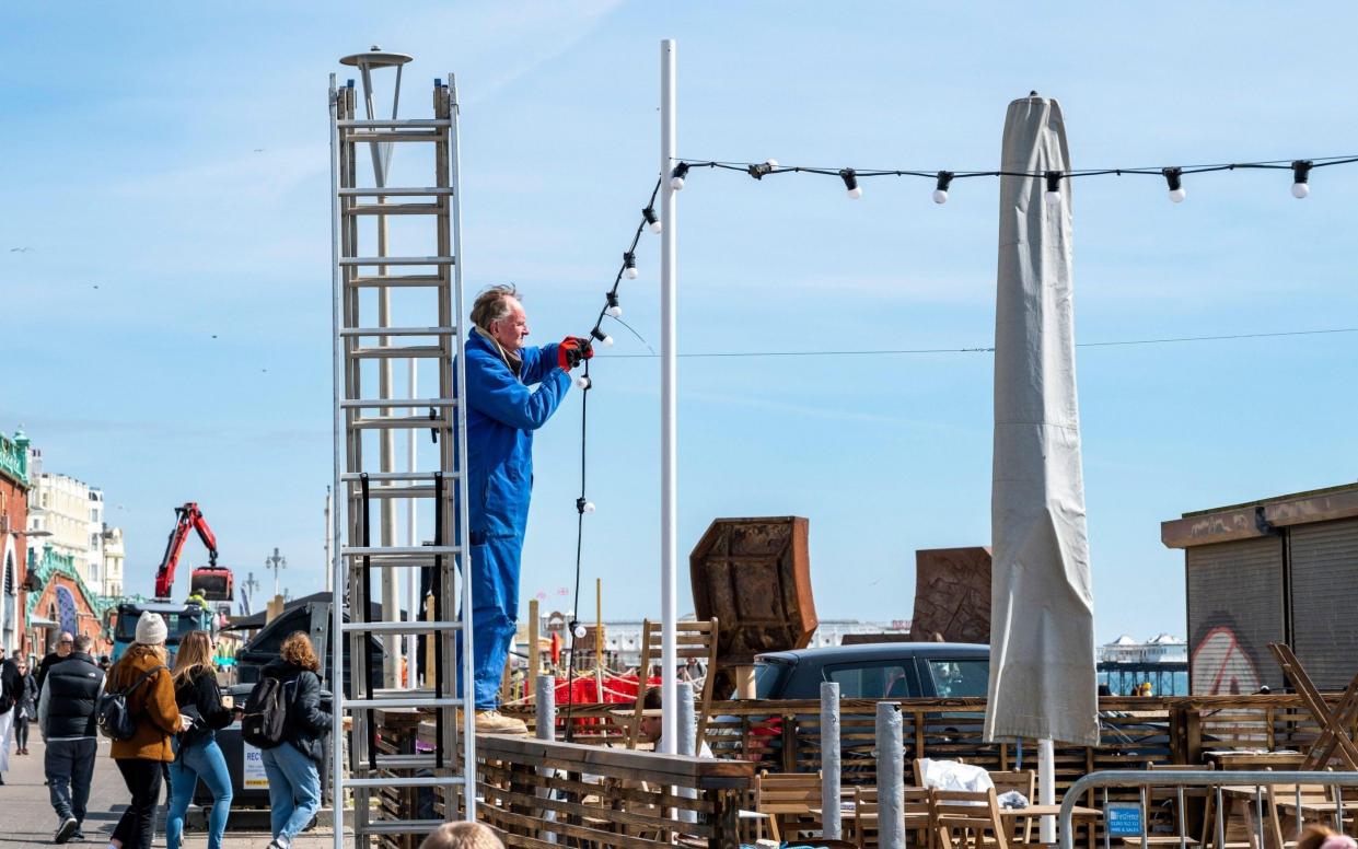 Lights go up in the seaside resort of Brighton as businesses prepare to reopen on Monday - Simon Dack /Alamy Live News 