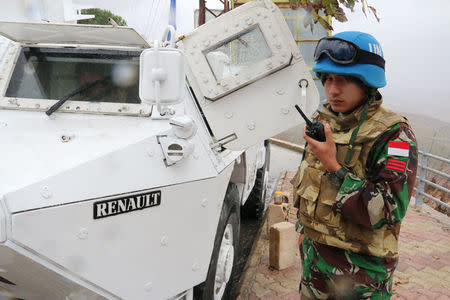 A U.N. peacekeeper patrols near the Lebanese-Israeli border as seen in southern village of Adaisseh, Lebanon November 21, 2017. REUTERS/ Karamallah Daher