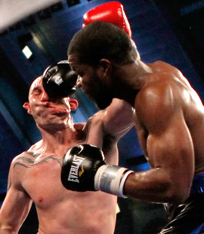 Boxer Lavarn Harvell (R) connects to the head of Tony Pietrantonio for a knockout during their third round of light heavyweight boxing fight in Atlantic City, New Jersey April 28, 2012. REUTERS/Tim Shaffer