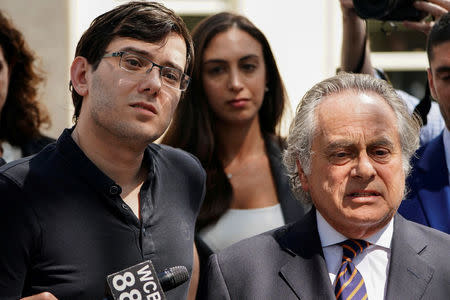 FILE PHOTO: Former drug company executive Martin Shkreli stands with his attorney Benjamin Brafman after exiting U.S. District Court upon being convicted of securities fraud, in the Brooklyn borough of New York City, U.S. on August 4, 2017. REUTERS/Carlo Allegri/File Photo