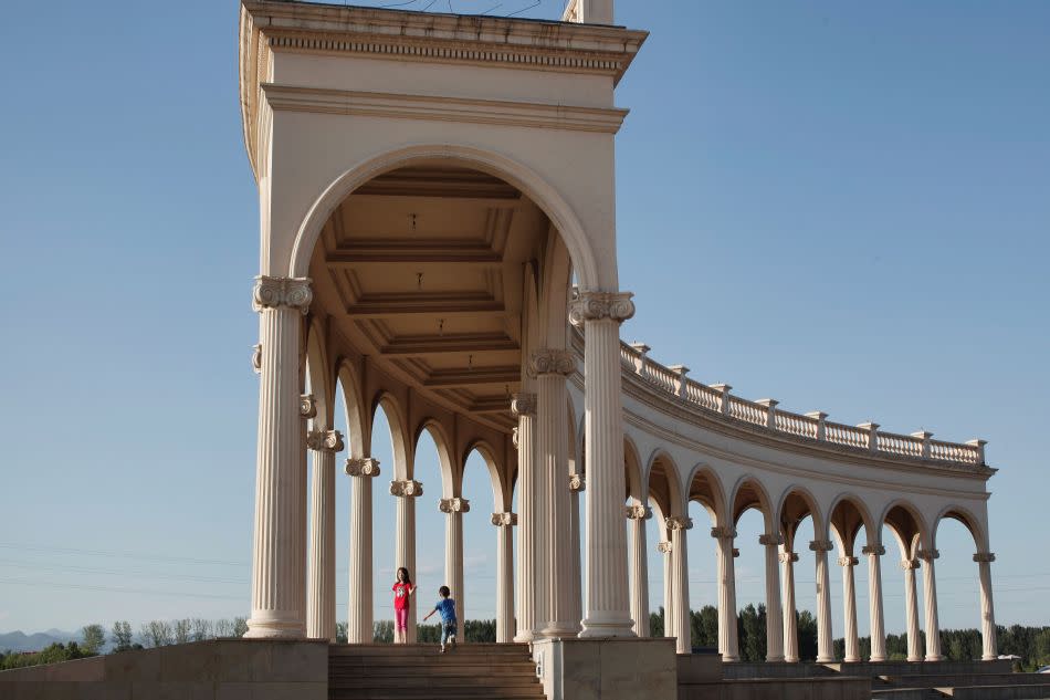 Tourists enjoy the view from the Beijing Laffitte Chateau hotel.