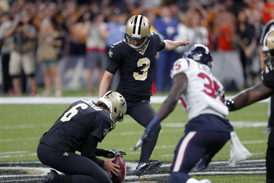 New Orleans Saints kicker Wil Lutz (3) kicks a 58 yard field goal as Thomas Morstead (6) holds, at the end of regulation, in the second half of an NFL football game against the Houston Texans in New Orleans, Monday, Sept. 9, 2019. The Saints won 30-28. (AP Photo/Bill Feig)
