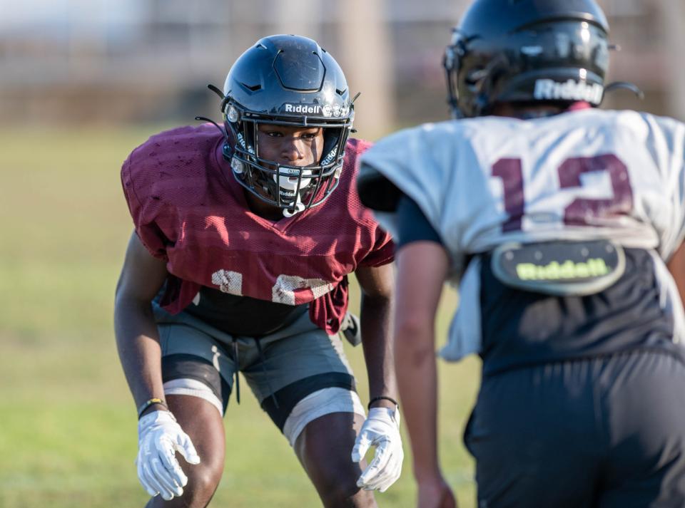 Tyrell Marshall (18) runs a drill during football practice at Navarre High School on Wednesday, Aug. 2, 2023.