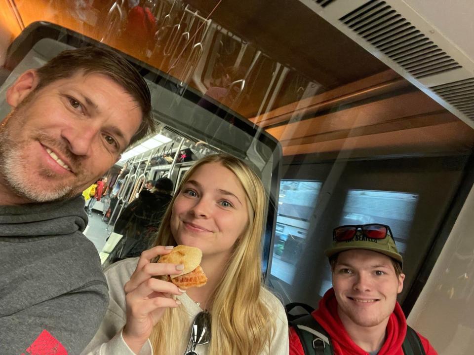Trenton Lehrkamp (right) is pictured with his sister and father as they travel to the out-of-state facility where he will continue his recovery.