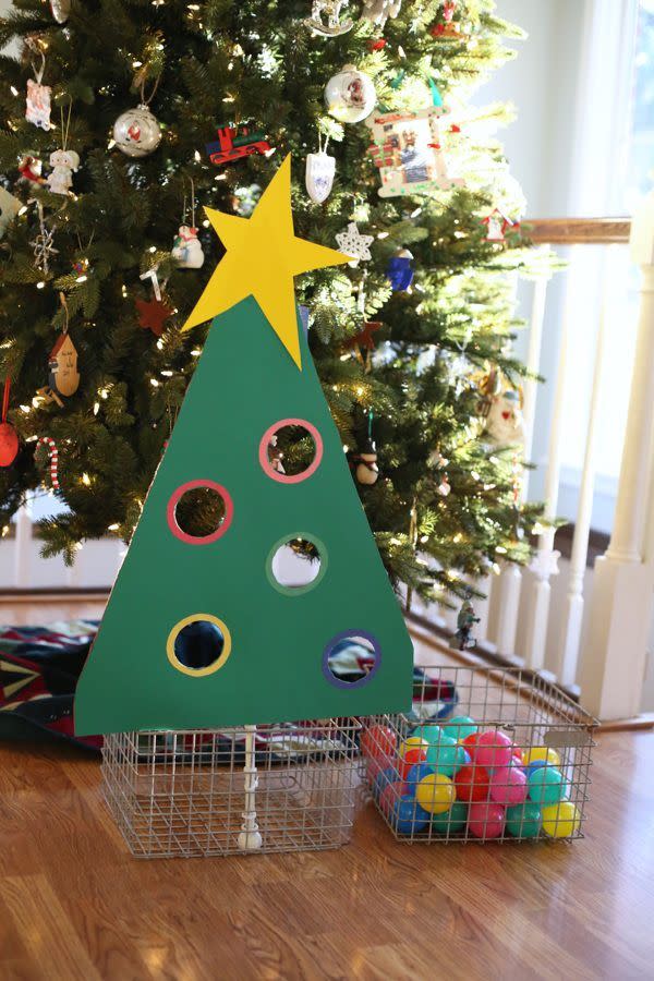 <p>This toddler-appropriate sorting game will help your little one work on their categorization skills while getting into the holiday spirit. Use some sturdy card stock or poster board to make a cardboard tree with circular colored cutouts, and then ask your kiddos to put the ornaments through the appropriate spaces. </p><p><em><a href="http://www.icanteachmychild.com/christmas-tree-ball-sort-for-toddlers/" rel="nofollow noopener" target="_blank" data-ylk="slk:Get the tutorial at I Can Teach My Child »;elm:context_link;itc:0;sec:content-canvas" class="link ">Get the tutorial at I Can Teach My Child »</a></em><br></p>