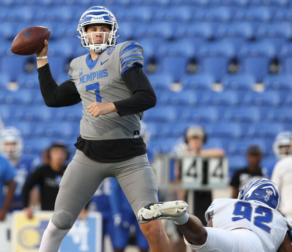 Memphis Tigers quarterback Grant Gunnell throws the ball during the Friday Night Stripes spring football game at Liberty Bowl Memorial Stadium on Friday, April 22, 2022. 