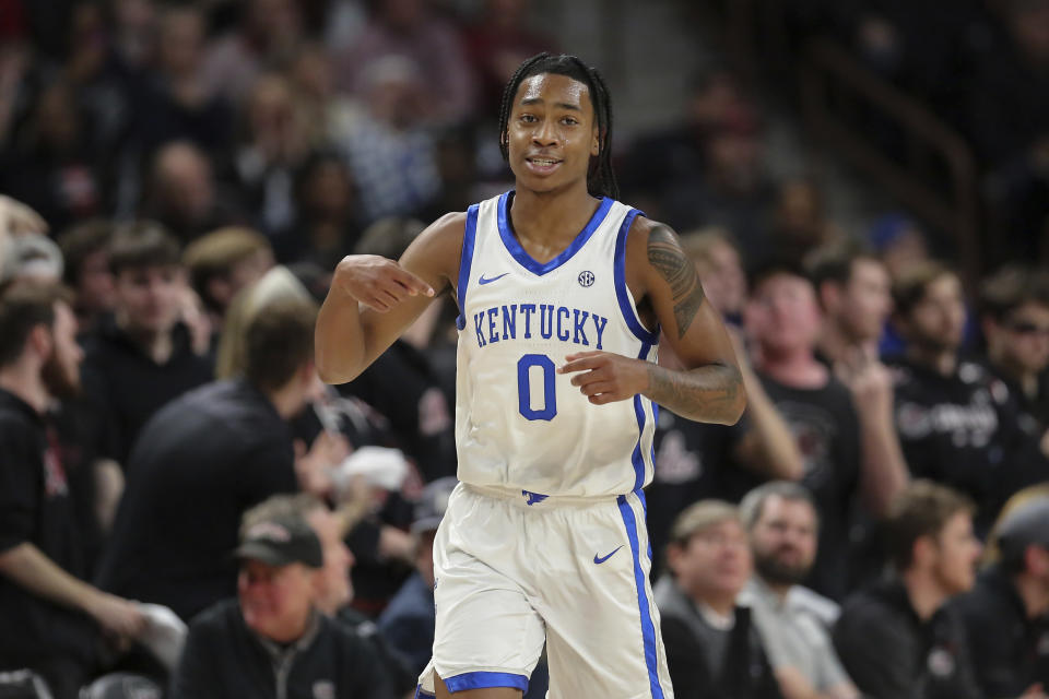 Kentucky guard Rob Dillingham points at his jersey after making a basket during the first half of the team's NCAA college basketball game against South Carolina on Tuesday, Jan. 23, 2024, in Columbia, S.C. (AP Photo/Artie Walker Jr.)