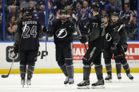 Tampa Bay Lightning left wing Alex Killorn (17) celebrates his goal against the Dallas Stars with teammates, including defenseman Zach Bogosian (24) and defenseman Victor Hedman (77) during the third period of an NHL hockey game Saturday, Jan. 15, 2022, in Tampa, Fla. (AP Photo/Chris O'Meara)